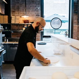 Chef preparing fresh pasta at The Grumpy Italian — a short trip from Annandale